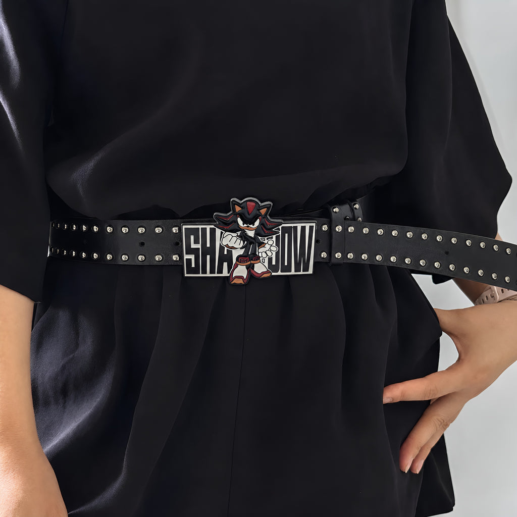Model wearing Shadow Retro graphic buckle belt over a black outfit