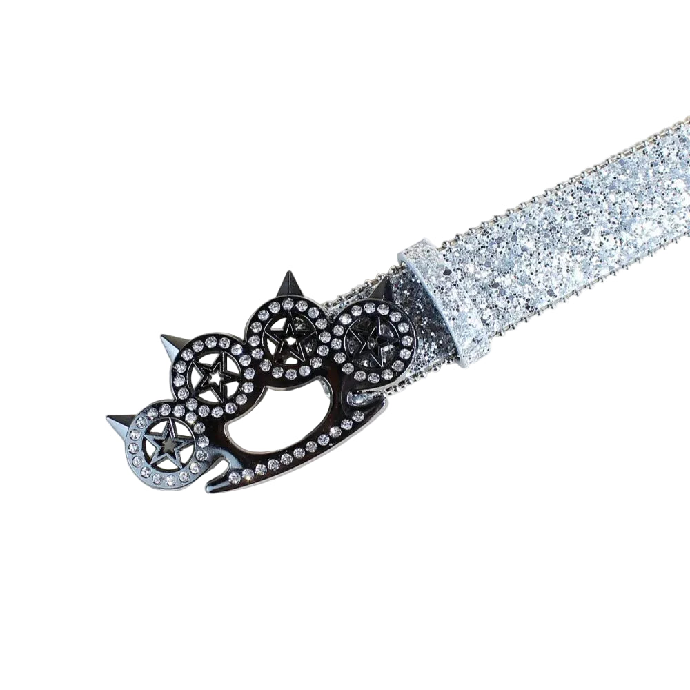 Close-up of silver glitter belt and rhinestone brass knuckle star buckle