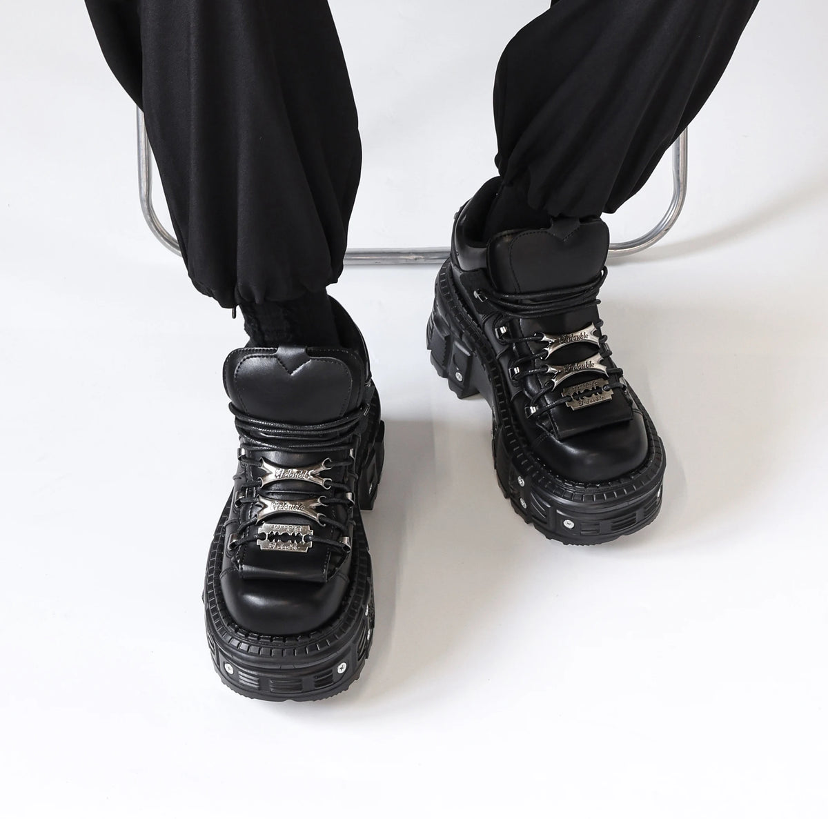 Black gothic lace-up platform ankle boots with metal detail