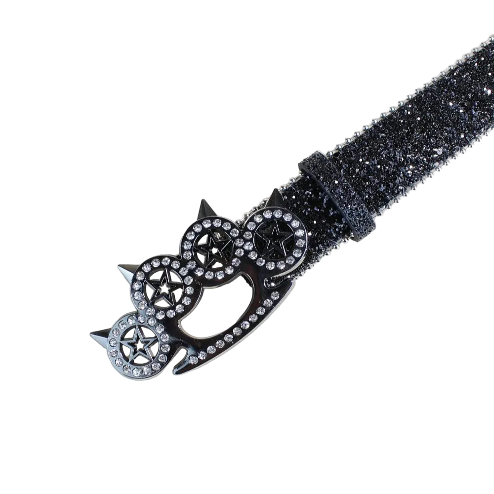 Close-up of black glitter belt and rhinestone brass knuckle star buckle