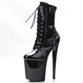 Black shiny platform ankle boots with cross-lace detail and spike heel